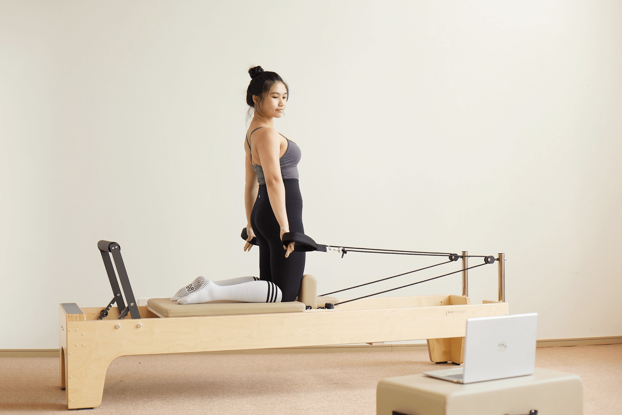 Pilates reformer with laptop